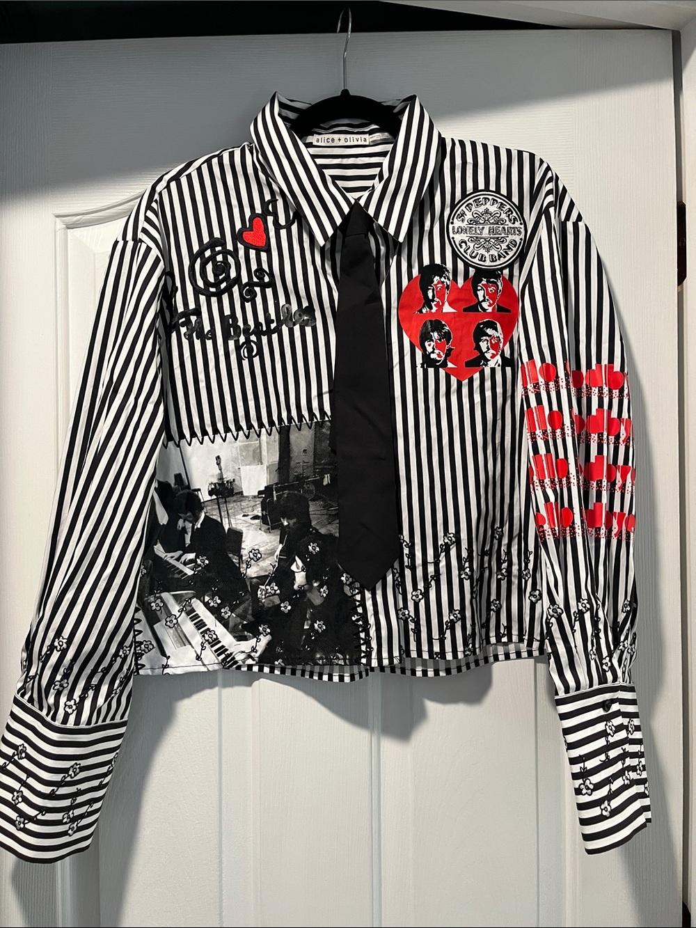 Alice + Olivia Black & White Striped Graphic Button-Up Shirt with Red Accents